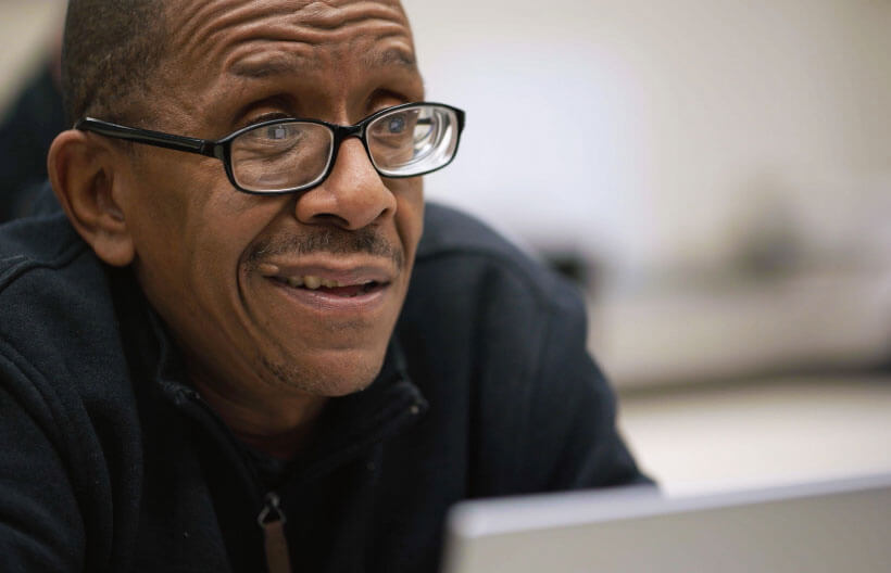 Man sitting in front of laptop