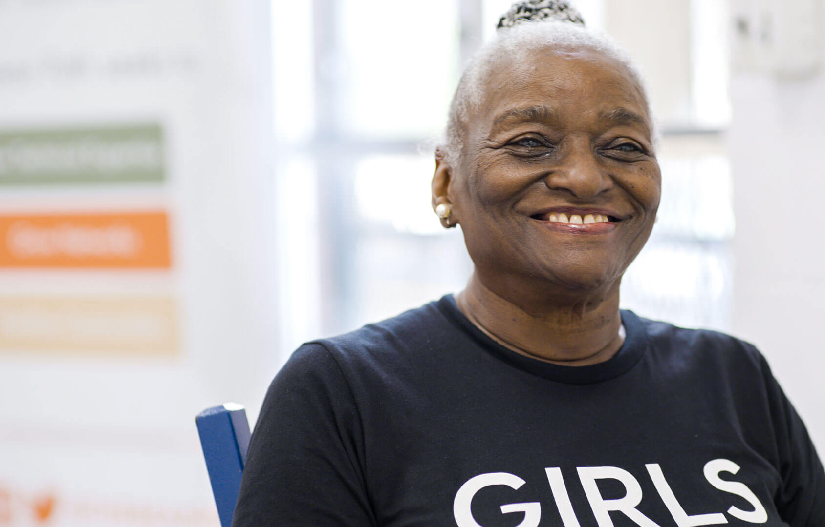 Woman sitting and smiling